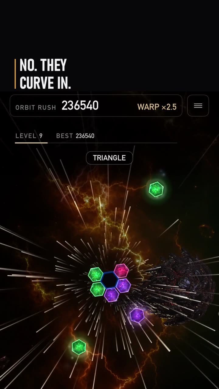 Still from the clip: Will the pieces go straight in?
The pieces curve in, pulled by the dark hexagon, the black hole's core.